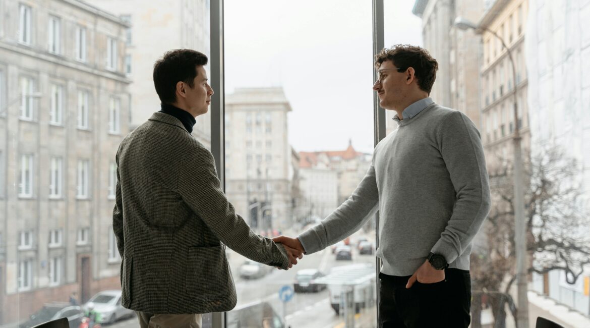 “Business owner shaking hands with direct lender after funding approval”